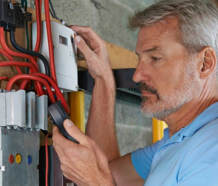 A man holding a remote control in his hand.